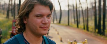 Movie still from “Prince Avalanche” (2013), directed by David Gordon Green – A man's face on the side of the road; Close Up shot, Over the shoulder angle