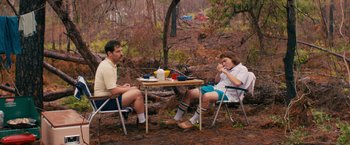 Movie still from “Prince Avalanche” (2013), directed by David Gordon Green – Two men sitting at a table in the woods; Wide shot, Low angle