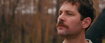 Movie still from “Prince Avalanche” (2013), directed by David Gordon Green – A person with a mustache; Close Up shot, Over the shoulder angle