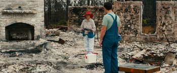 Movie still from “Prince Avalanche” (2013), directed by David Gordon Green – Two people standing in the middle of a burned area; Wide shot, Over the shoulder angle