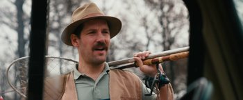 Movie still from “Prince Avalanche” (2013), directed by David Gordon Green – A man in a hat holding a wooden stick; Close Up shot, Low angle