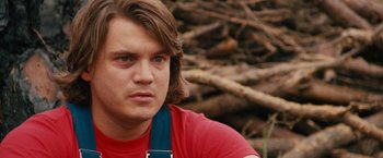Movie still from “Prince Avalanche” (2013), directed by David Gordon Green – A person with long brown hair; Close Up shot, Over the shoulder angle