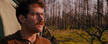 Movie still from “Prince Avalanche” (2013), directed by David Gordon Green – A person wearing glasses and a mustache; Close Up shot, Low angle