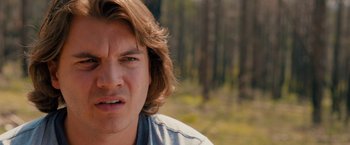 Movie still from “Prince Avalanche” (2013), directed by David Gordon Green – A person with long brown hair; Close Up shot, Over the shoulder angle