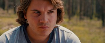 Movie still from “Prince Avalanche” (2013), directed by David Gordon Green – A man's face in a wooded area; Close Up shot, Over the shoulder angle