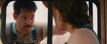 Movie still from “Prince Avalanche” (2013), directed by David Gordon Green – Two men looking at each other through a window; Close Up shot, Over the shoulder angle