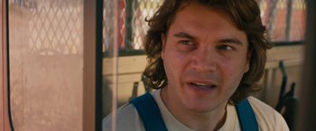 Movie still from “Prince Avalanche” (2013), directed by David Gordon Green – A person with long curly hair; Close Up shot, Over the shoulder angle