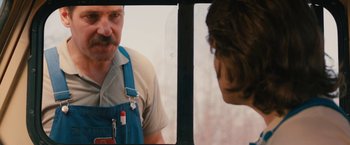 Movie still from “Prince Avalanche” (2013), directed by David Gordon Green – A man looking at himself in the mirror; Close Up shot, Over the shoulder angle
