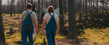 Movie still from “Prince Avalanche” (2013), directed by David Gordon Green – A man and a woman walking through the woods; Wide shot, Low angle