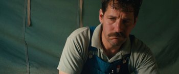 Movie still from “Prince Avalanche” (2013), directed by David Gordon Green – A person with a mustache; Close Up shot, Low angle