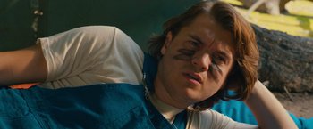 Movie still from “Prince Avalanche” (2013), directed by David Gordon Green – A person with a face paint on; Close Up shot, Low angle