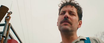 Movie still from “Prince Avalanche” (2013), directed by David Gordon Green – A person with his eyes closed; Close Up shot, Low angle