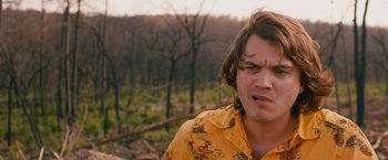 Movie still from “Prince Avalanche” (2013), directed by David Gordon Green – A man in a yellow shirt is standing in the woods; Close Up shot, Over the shoulder angle