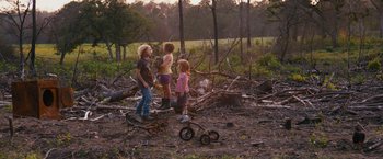 Movie still from “Prince Avalanche” (2013), directed by David Gordon Green – Three children standing in the middle of a forest; Wide shot, Over the shoulder angle