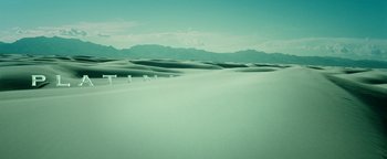Movie still from “Project Almanac” (2015), directed by Dean Israelite – A view of a large expanse of sand dunes; Extreme Wide shot, High angle