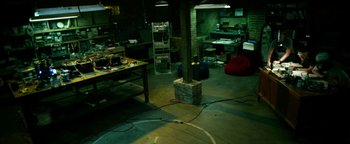 Movie still from “Project Almanac” (2015), directed by Dean Israelite – A room filled with lots of furniture in it; Extreme Wide shot, High angle