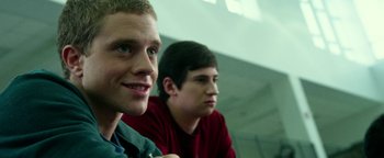 Movie still from “Project Almanac” (2015), directed by Dean Israelite – Two young men sitting next to each other in a room; Close Up shot, Low angle