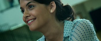 Movie still from “Project Almanac” (2015), directed by Dean Israelite – A person wearing a blue and white polka dot shirt; Close Up shot, Over the shoulder angle