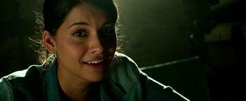 Movie still from “Project Almanac” (2015), directed by Dean Israelite – A person smiling for the camera; Close Up shot, High angle