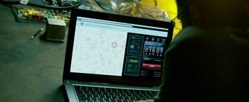 Movie still from “Project Almanac” (2015), directed by Dean Israelite – A laptop computer sitting on top of a table; Extreme Close Up shot, High angle
