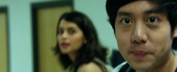 Movie still from “Project Almanac” (2015), directed by Dean Israelite – A man and a woman standing next to each other; Close Up shot, Over the shoulder angle