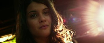 Movie still from “Project Almanac” (2015), directed by Dean Israelite – A woman's face in the sunlight; Close Up shot, Low angle