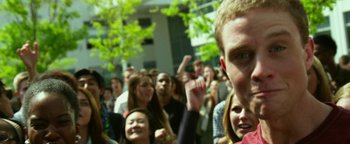 Movie still from “Project Almanac” (2015), directed by Dean Israelite – A group of people standing in front of a building; Close Up shot, Low angle