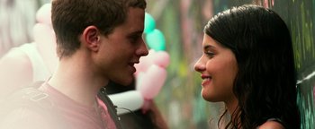 Movie still from “Project Almanac” (2015), directed by Dean Israelite – A man and a woman looking at one another; Close Up shot, Low angle