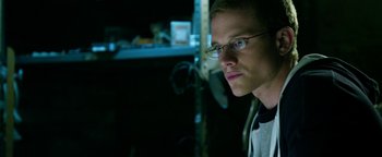 Movie still from “Project Almanac” (2015), directed by Dean Israelite – A man with glasses is looking into the distance; Close Up shot, Low angle