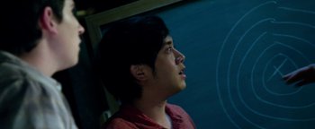 Movie still from “Project Almanac” (2015), directed by Dean Israelite – A young man is looking up at the sky; Close Up shot, Overhead angle