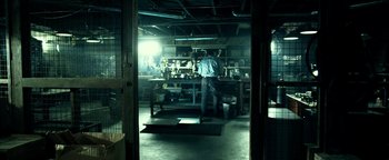 Movie still from “Project Almanac” (2015), directed by Dean Israelite – A man standing in front of an oven in a kitchen; Wide shot, Low angle