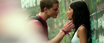 Movie still from “Project Almanac” (2015), directed by Dean Israelite – A man and a woman are looking at one another; Close Up shot, Low angle