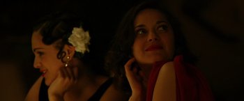 Movie still from “Public Enemies” (2009), directed by Michael Mann – A woman with a white flower in her hair; Close Up shot, Over the shoulder angle