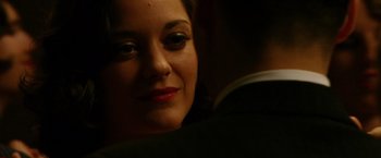 Movie still from “Public Enemies” (2009), directed by Michael Mann – A woman's face in the dark; Close Up shot, Over the shoulder angle
