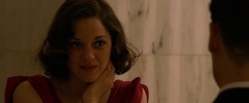 Movie still from “Public Enemies” (2009), directed by Michael Mann – A person wearing a red shirt; Close Up shot, Over the shoulder angle