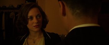 Movie still from “Public Enemies” (2009), directed by Michael Mann – A man and a woman looking at each other in a mirror; Close Up shot, Over the shoulder angle