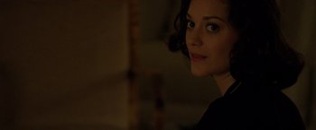 Movie still from “Public Enemies” (2009), directed by Michael Mann – A person wearing a black shirt; Close Up shot, Over the shoulder angle