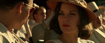 Movie still from “Public Enemies” (2009), directed by Michael Mann – A person wearing a hat; Close Up shot, Over the shoulder angle