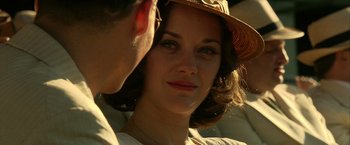 Movie still from “Public Enemies” (2009), directed by Michael Mann – A man and a woman wearing a hat; Close Up shot, Over the shoulder angle
