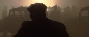 Movie still from “Public Enemies” (2009), directed by Michael Mann – A man in a black hat is looking into the distance; Extreme Close Up shot, Low angle