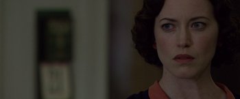 Movie still from “Public Enemies” (2009), directed by Michael Mann – A woman's face in front of a mirror; Close Up shot, Over the shoulder angle