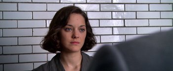 Movie still from “Public Enemies” (2009), directed by Michael Mann – A person with short brown hair; Close Up shot, Over the shoulder angle