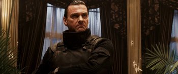 Movie still from “Punisher: War Zone” (2008), directed by Lexi Alexander – A person wearing a suit; Close Up shot, Low angle