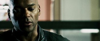 Movie still from “Punisher: War Zone” (2008), directed by Lexi Alexander – A person wearing a leather jacket; Close Up shot, Over the shoulder angle