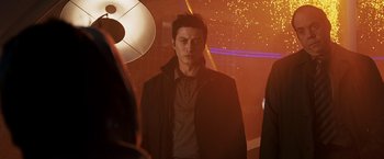 Movie still from “Punisher: War Zone” (2008), directed by Lexi Alexander – A man in a black jacket standing in front of a mirror; Medium shot, Low angle