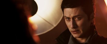 Movie still from “Punisher: War Zone” (2008), directed by Lexi Alexander – A man's face in front of a lamp; Close Up shot, Over the shoulder angle