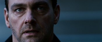 Movie still from “Punisher: War Zone” (2008), directed by Lexi Alexander – A man's face in the dark; Extreme Close Up shot, Low angle