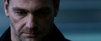 Movie still from “Punisher: War Zone” (2008), directed by Lexi Alexander – A man's face in a dark room; Extreme Close Up shot, Low angle