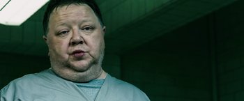 Movie still from “Punisher: War Zone” (2008), directed by Lexi Alexander – A person wearing a shirt; Close Up shot, Low angle