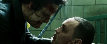 Movie still from “Punisher: War Zone” (2008), directed by Lexi Alexander – A man and a woman face each other in a bathroom; Close Up shot, Over the shoulder angle